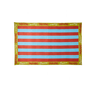A rectangular tablecloth with vertical red and light blue stripes, bordered by a yellow-green edge printed repeatedly with the word 'PARADIS'.