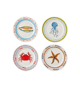 Four decorative ceramic plates arranged in a 2x2 grid on a white background, each featuring a different nautical design: two fish, a jellyfish, a red crab, and an orange starfish, all with blue and multicolor border patterns.